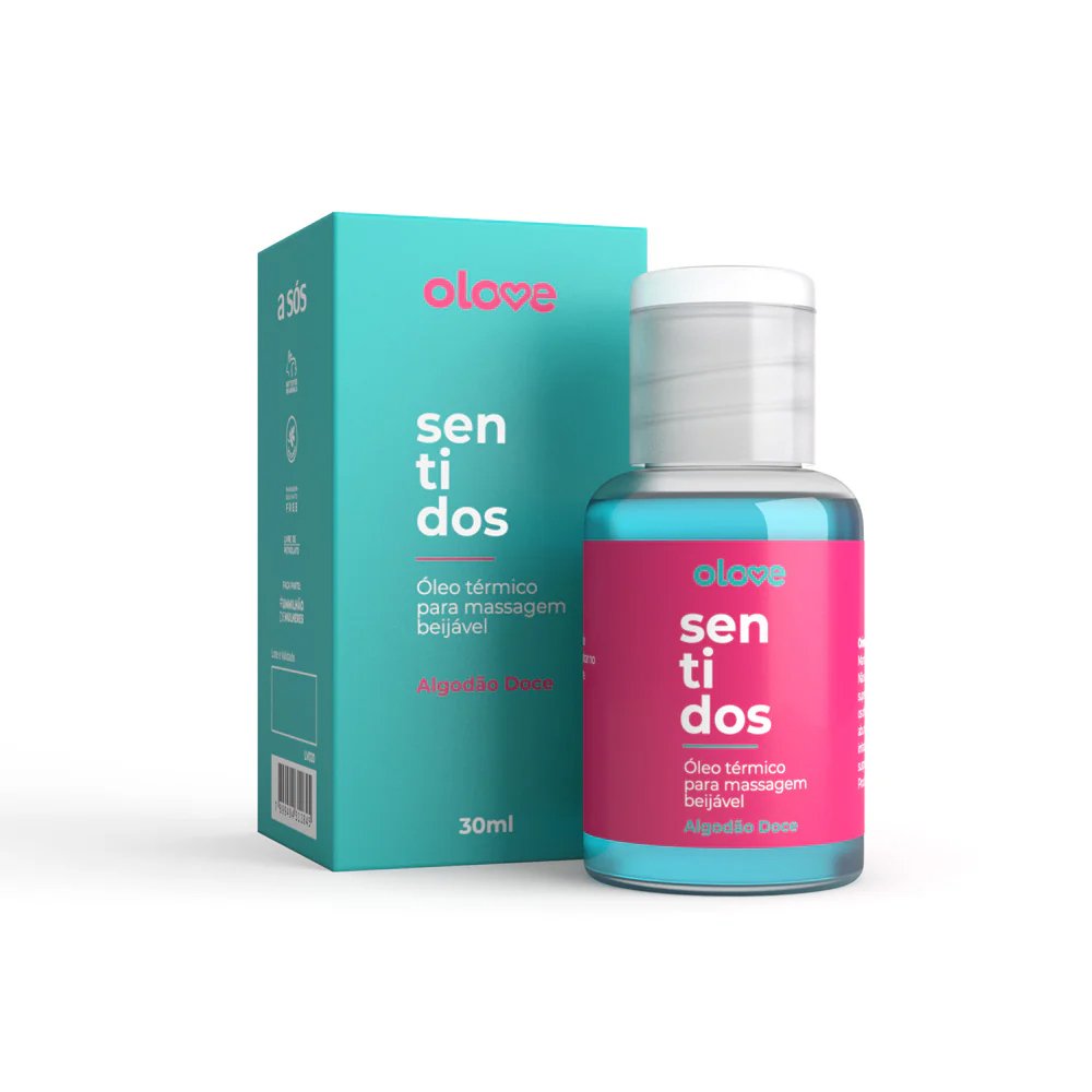 Pessoa segurando o frasco do �leo para Massagem Sensual Olove Sentidos Algod�o Doce 30ml com a caixa do produto ao fundo