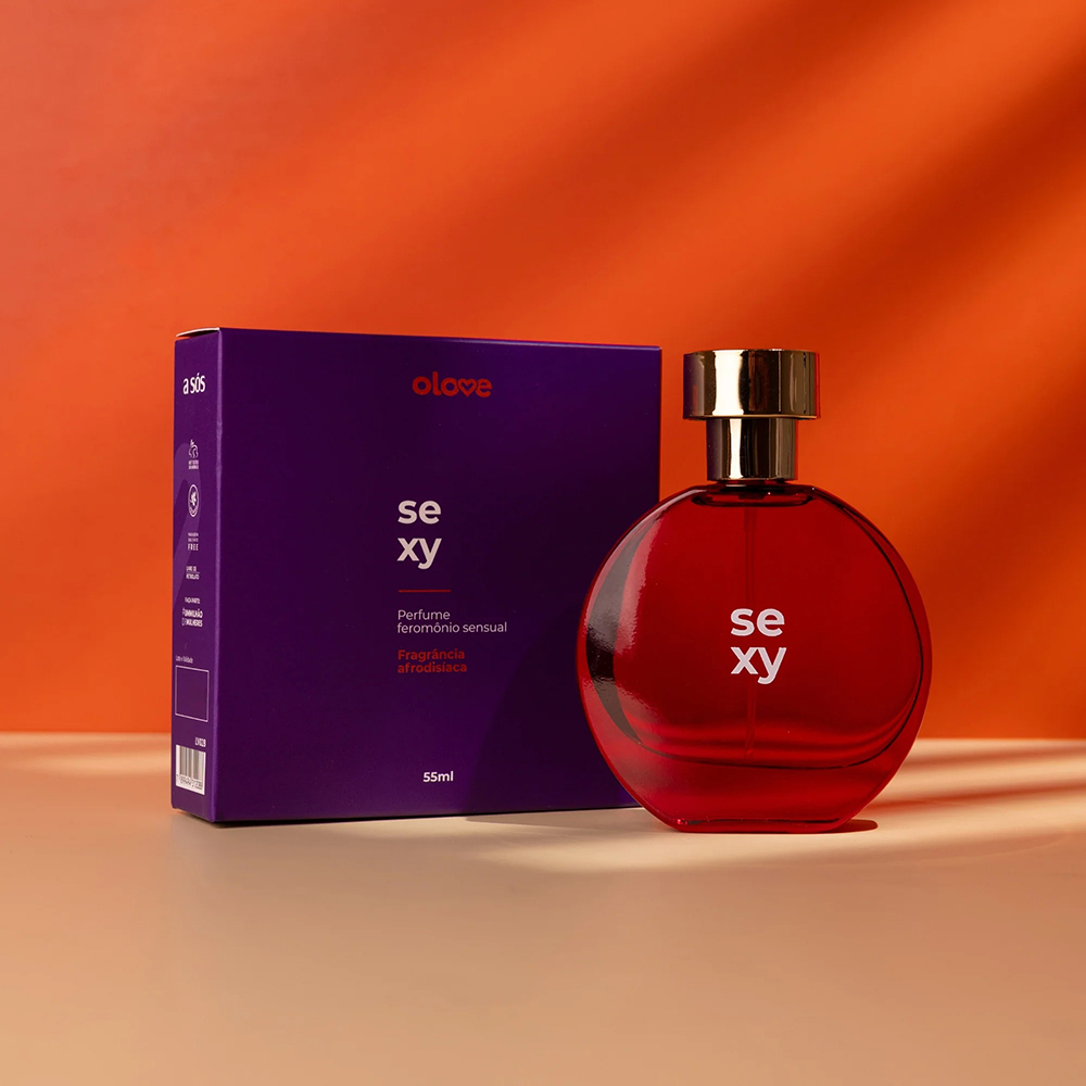Perfume Olove Sexy com frasco vermelho redondo e caixa roxa, destacando a fragr�ncia afrodis�aca frutal doce