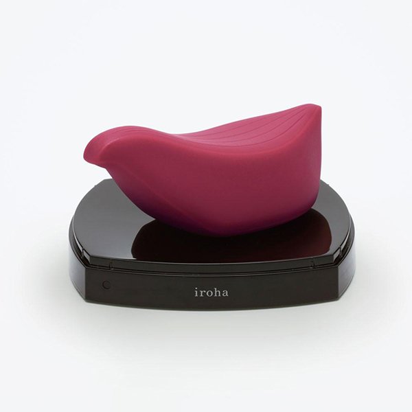Vibrador Tori Iroha by Tenga sobre base de recarga, destacando design elegante e funcionalidade