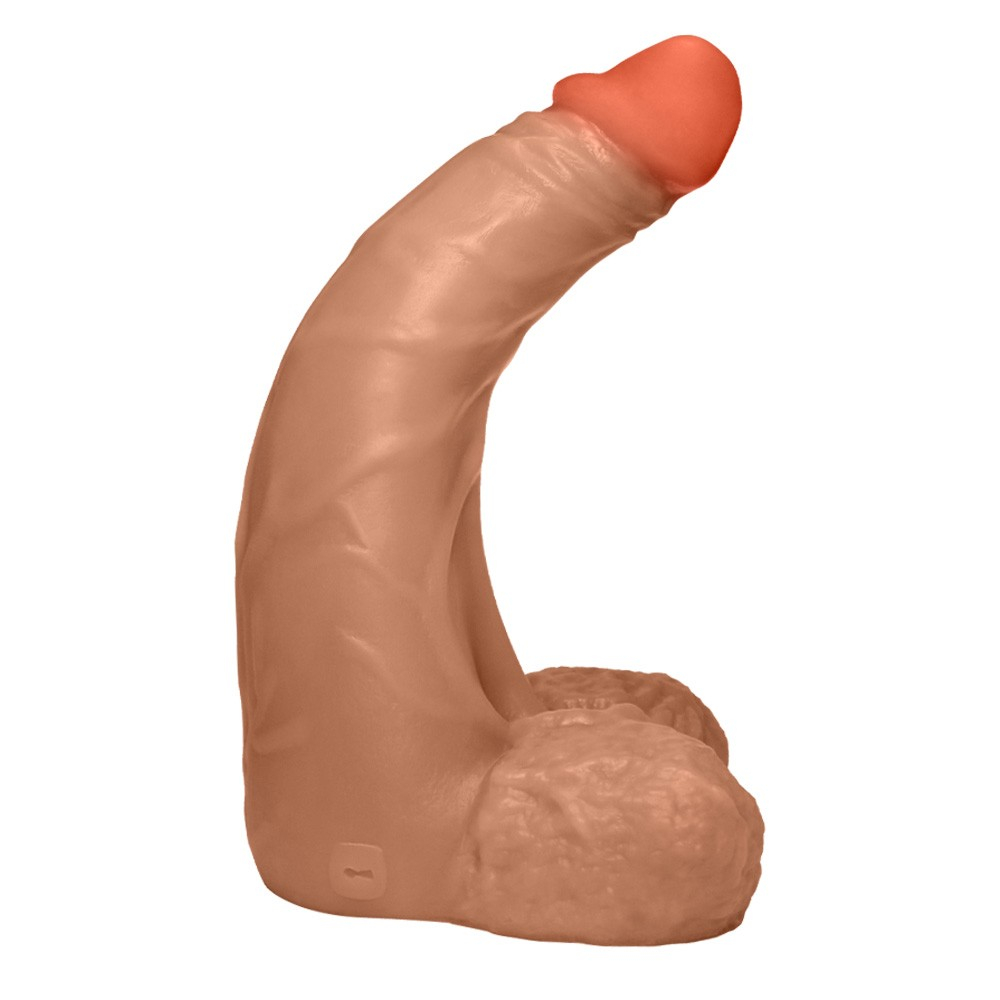 P�nis gigante e grosso flex�vel com escroto profundo em uma superf�cie clara, destacando o tom bege e a textura
